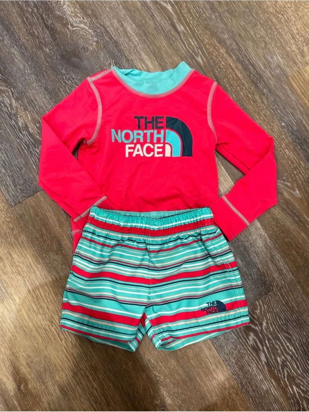 The North Face Kids pink Rashguard with Teal & pink Striped Swim Shorts